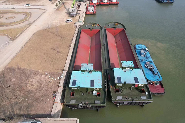 Hur förbättrar en delad hopperpråm muddringseffektiviteten och marina materialtransporter?